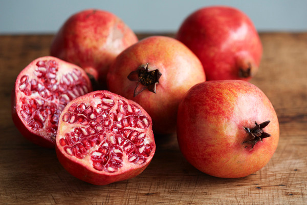 Pomegranates on a wooden table