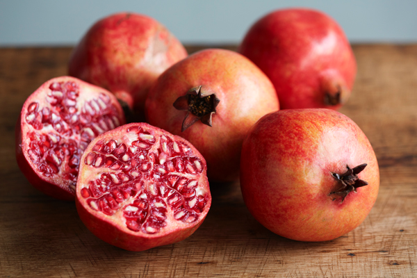 Pomegranates on a wooden table